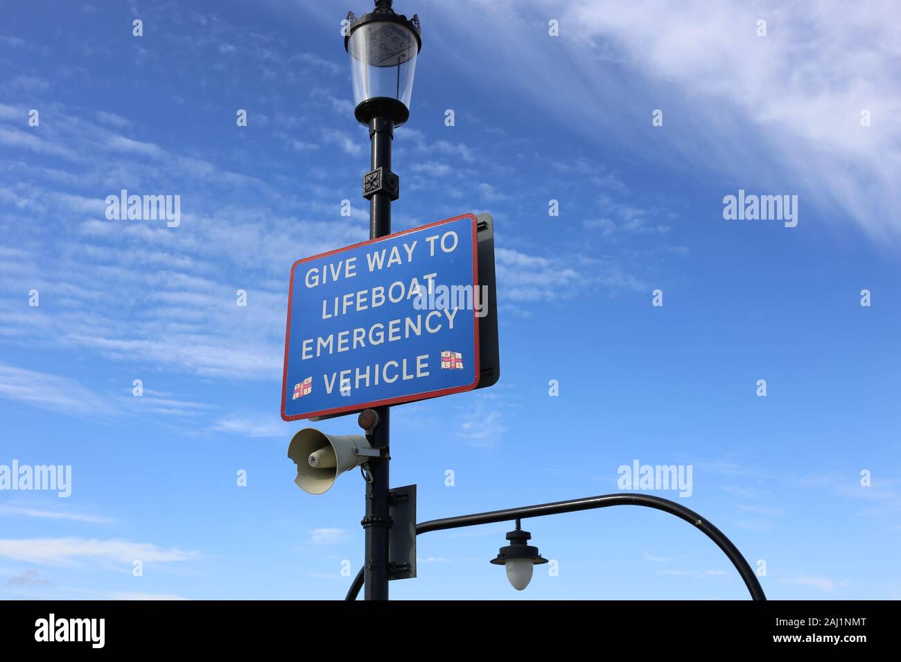 A sign with the words 'Give way to lifeboat emergency vehicle', on Southend pier, Essex. Stock Photo