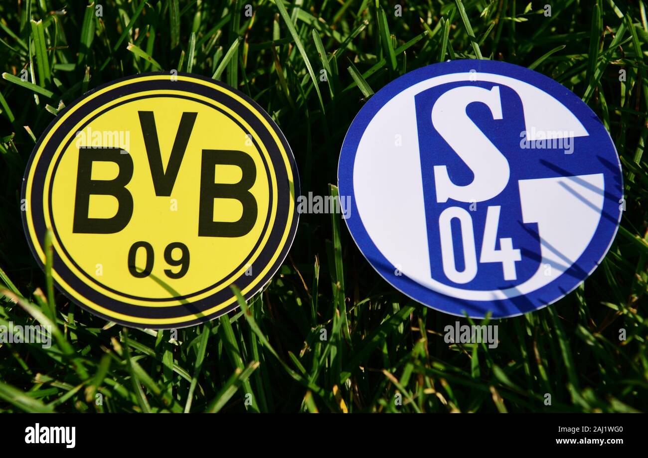 September 6, 2019, Munich, Germany. Emblems of German football clubs Borussia Dortmund and Schalke 04 Gelsenkirchen on the green lawn Stock Photo