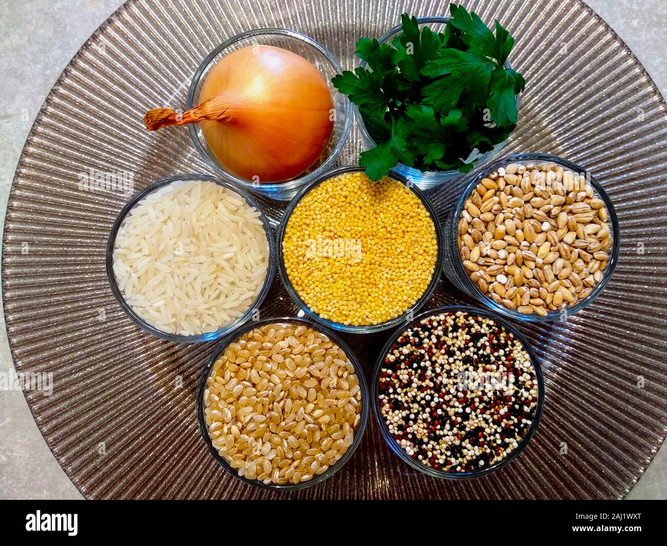 Cooking ingredients in clear glass cups. white jasmine rice, whole