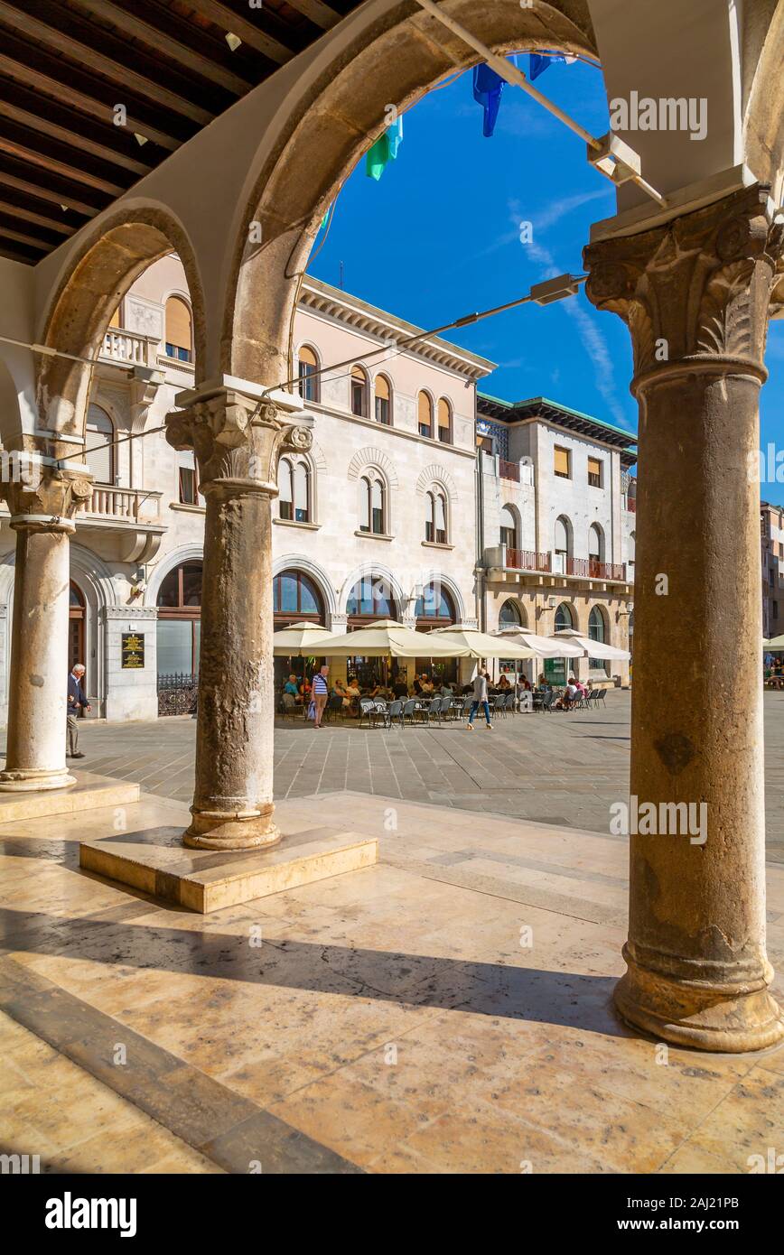 View of cafes from arches of the Town Hall in Forum Square, Pula, Istria County, Croatia, Adriatic, Europe Stock Photo