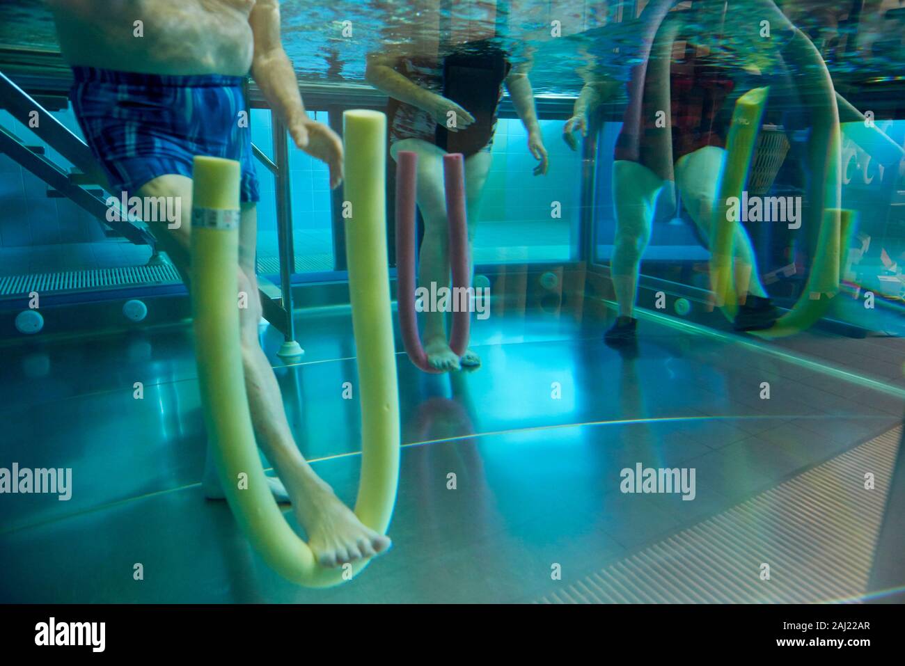 underwater photo of water aerobics as rehabilitation with elderly persons Stock Photo
