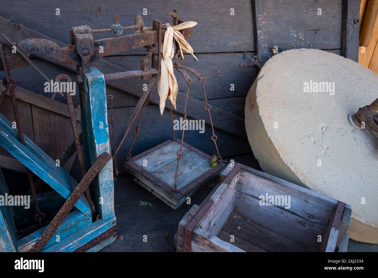 an old balance, an old box and a whetstone Stock Photo