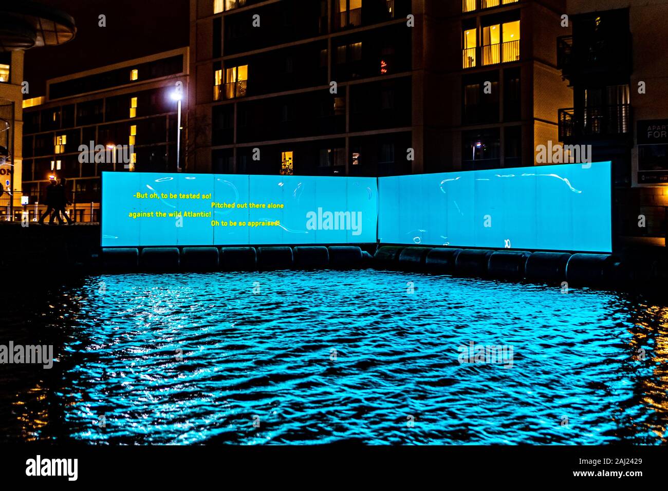 Edinburgh, UK. Wed 1st January 2020. The opening night of “Message from the Skies: Shorelines”, a collection of letters to Scotland reflecting on our relationship with our seas, waters and coasts and our maritime heritage. This projection is “Seascape with WEC” which takes place by the Union Canal in Fountainbridge and features writer Kathleen Jamie, designer Thomas Moulson and projection by Bright Side Studios. Kathleen Jamie’s poem “Seascape with WEC” captures her curiosity with new wave energy converters she witnessed being tested on the Orkney Islands. Stock Photo