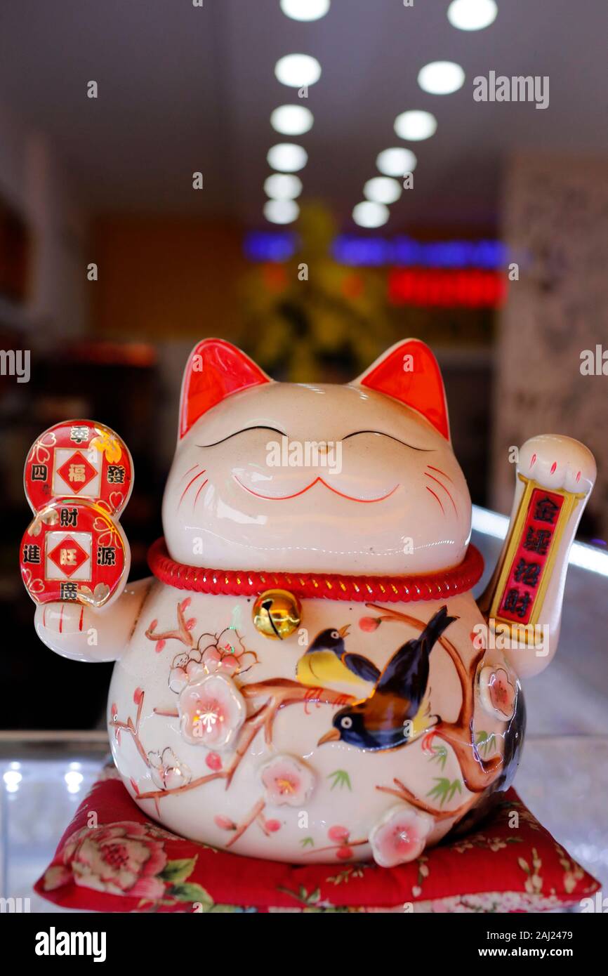 Lucky Cat in shop symbolizing good luck and good fortune, Ho Chi Minh City, Vietnam, Indochina, Southeast Asia, Asia Stock Photo