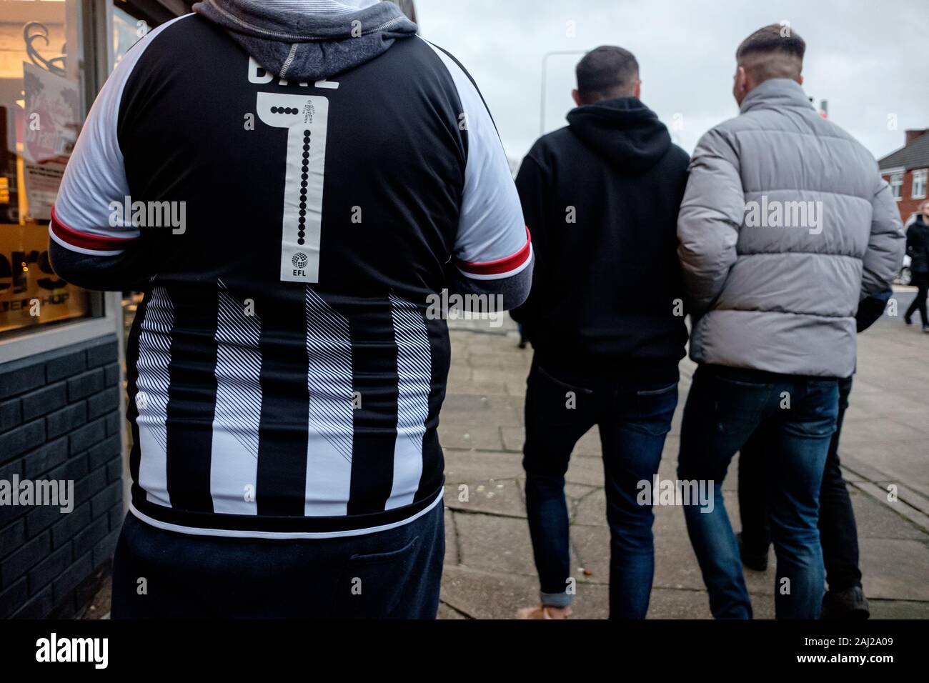 Grimsby Town football fans leaving Blundell Park stadium in Cleethorpes, UK, following the League two match against Scunthorpe United in December 2019 Stock Photo