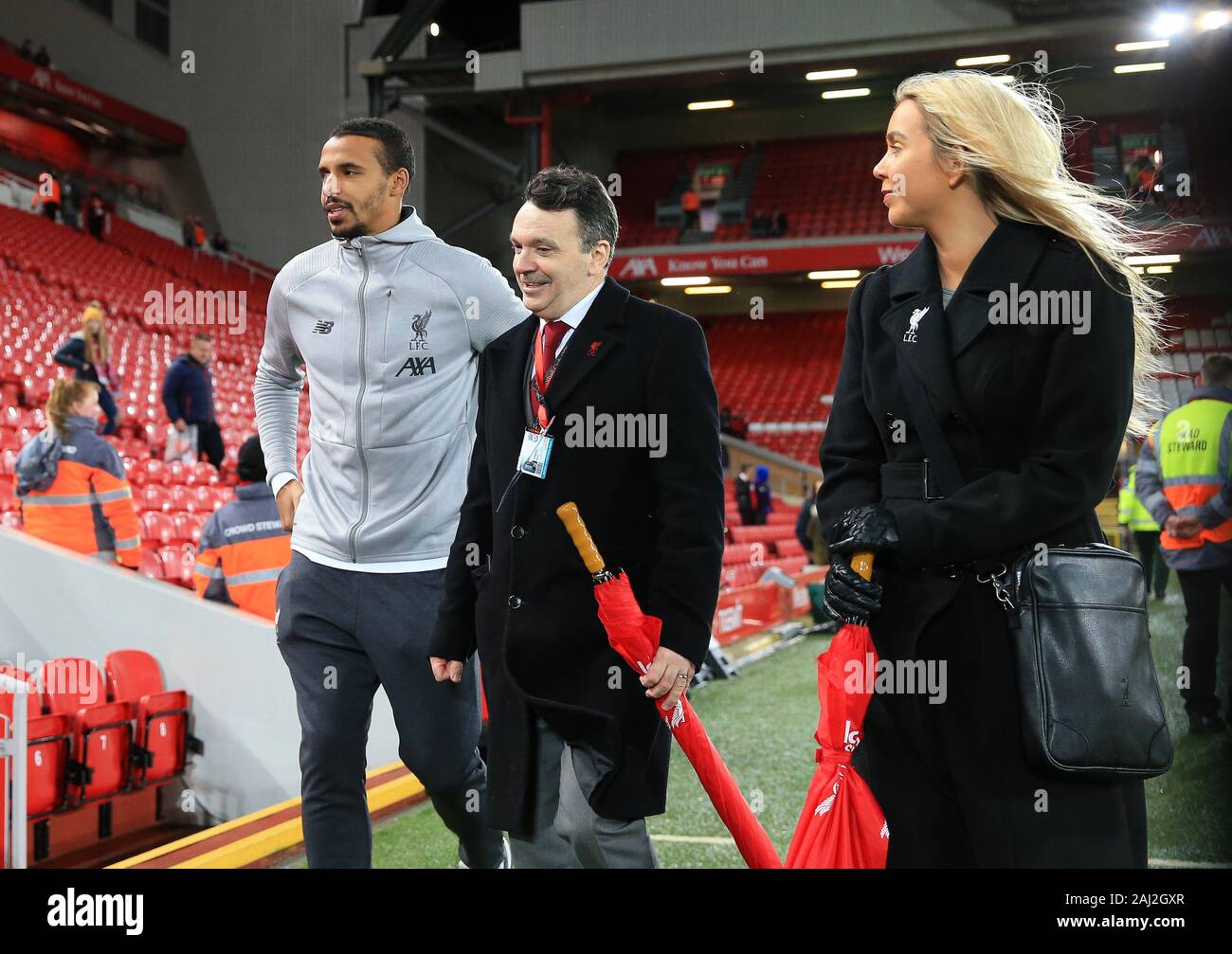 Anfield, Liverpool, Merseyside, UK. 2nd Jan, 2020. English Premier League Football, Liverpool versus Sheffield United; Joel Matip of Liverpool, presently out of the squad through injury, is escorted to the players tunnel prior to the match - Strictly Editorial Use Only. No use with unauthorized audio, video, data, fixture lists, club/league logos or 'live' services. Online in-match use limited to 120 images, no video emulation. No use in betting, games or single club/league/player publications Credit: Action Plus Sports/Alamy Live News Stock Photo