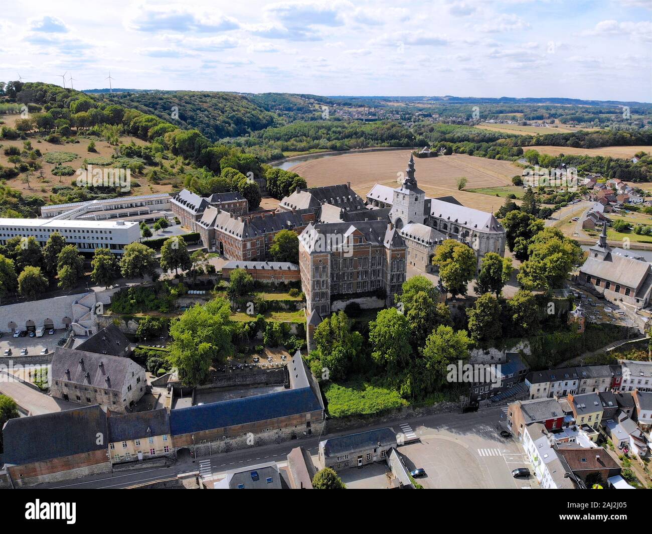 Aerial view of Floreffe Abbey during summer day, Belgium. Old abbey where they produced famous Floreffe beer. Top view green valley with beautiful abbey. Stock Photo