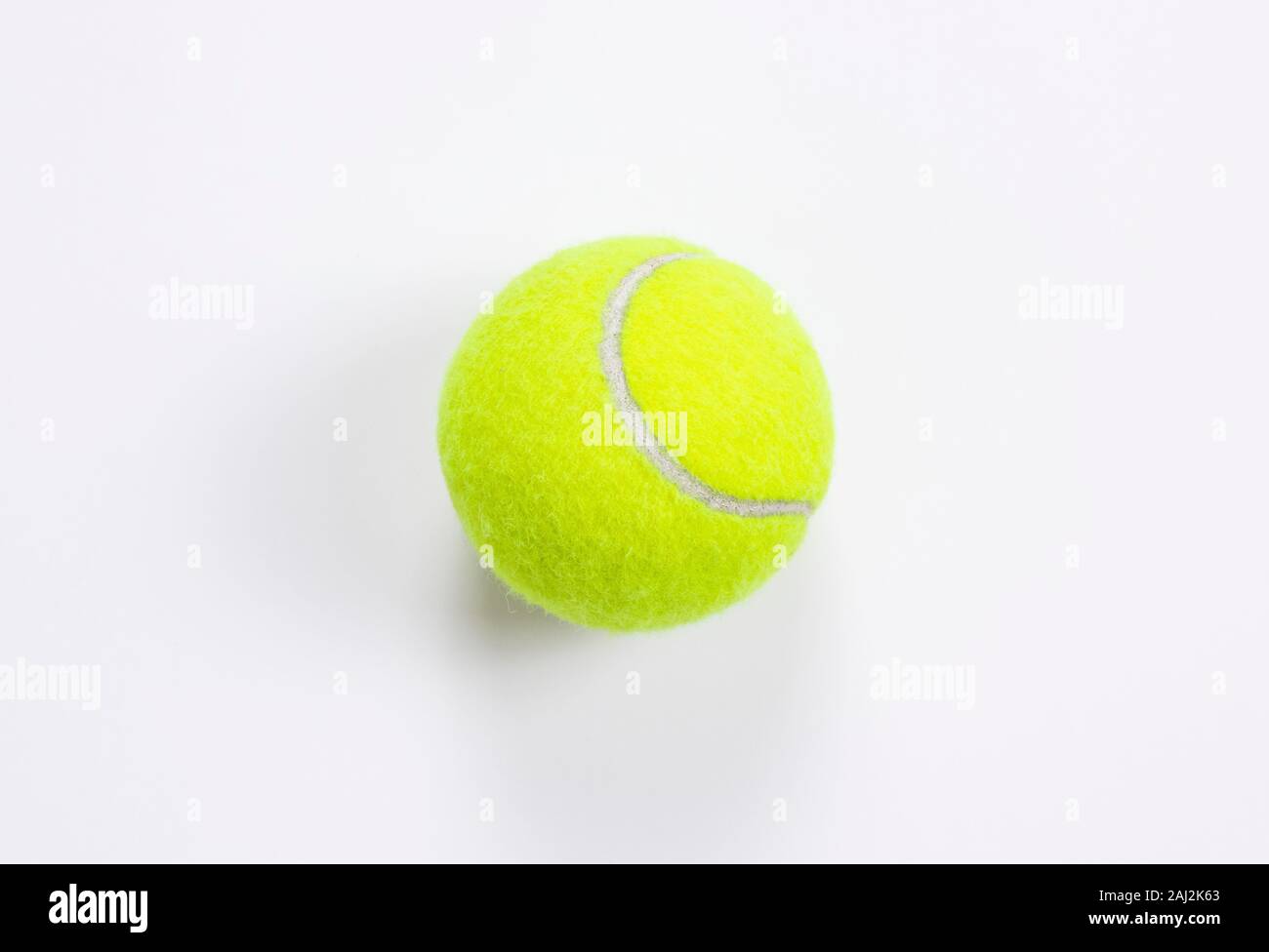 Single tennis ball isolated white background. Top view Stock Photo