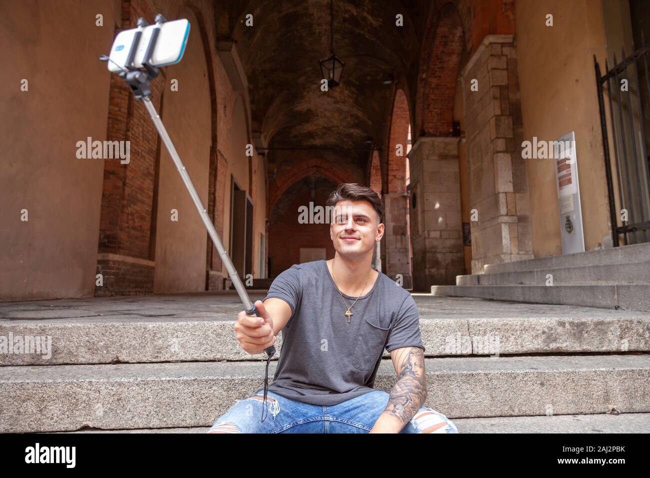 young of the millennium generation taking a selfie in a city of art. technological concept with always connected millennials Stock Photo