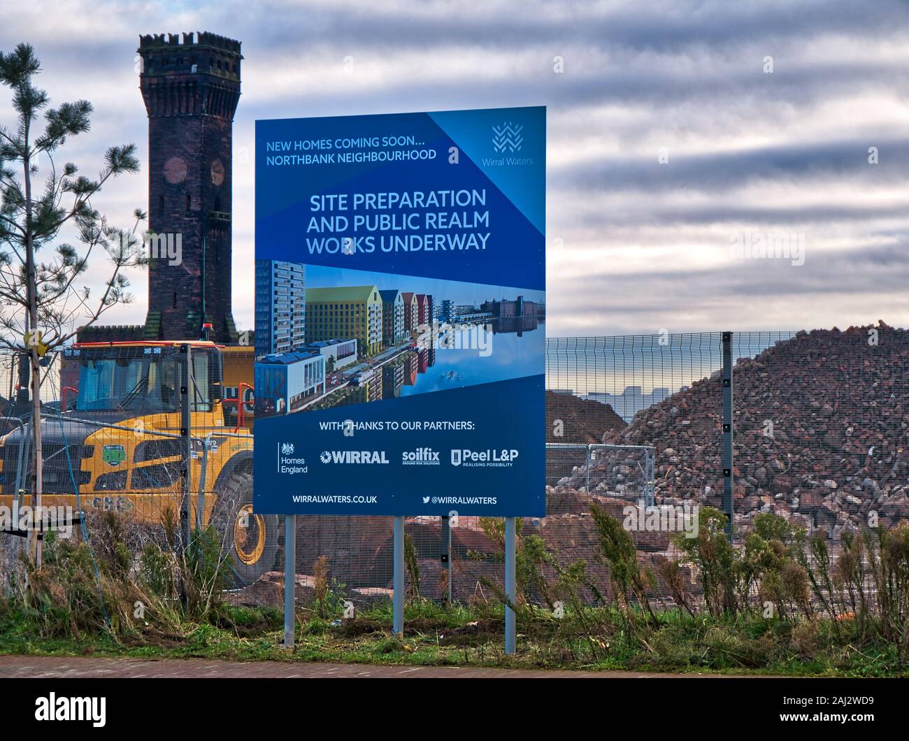 Signage and earth moving / construction equipment at the Wirral Waters development site in Birkenhead, Wirral - a large inner-city redevelopment progr Stock Photo