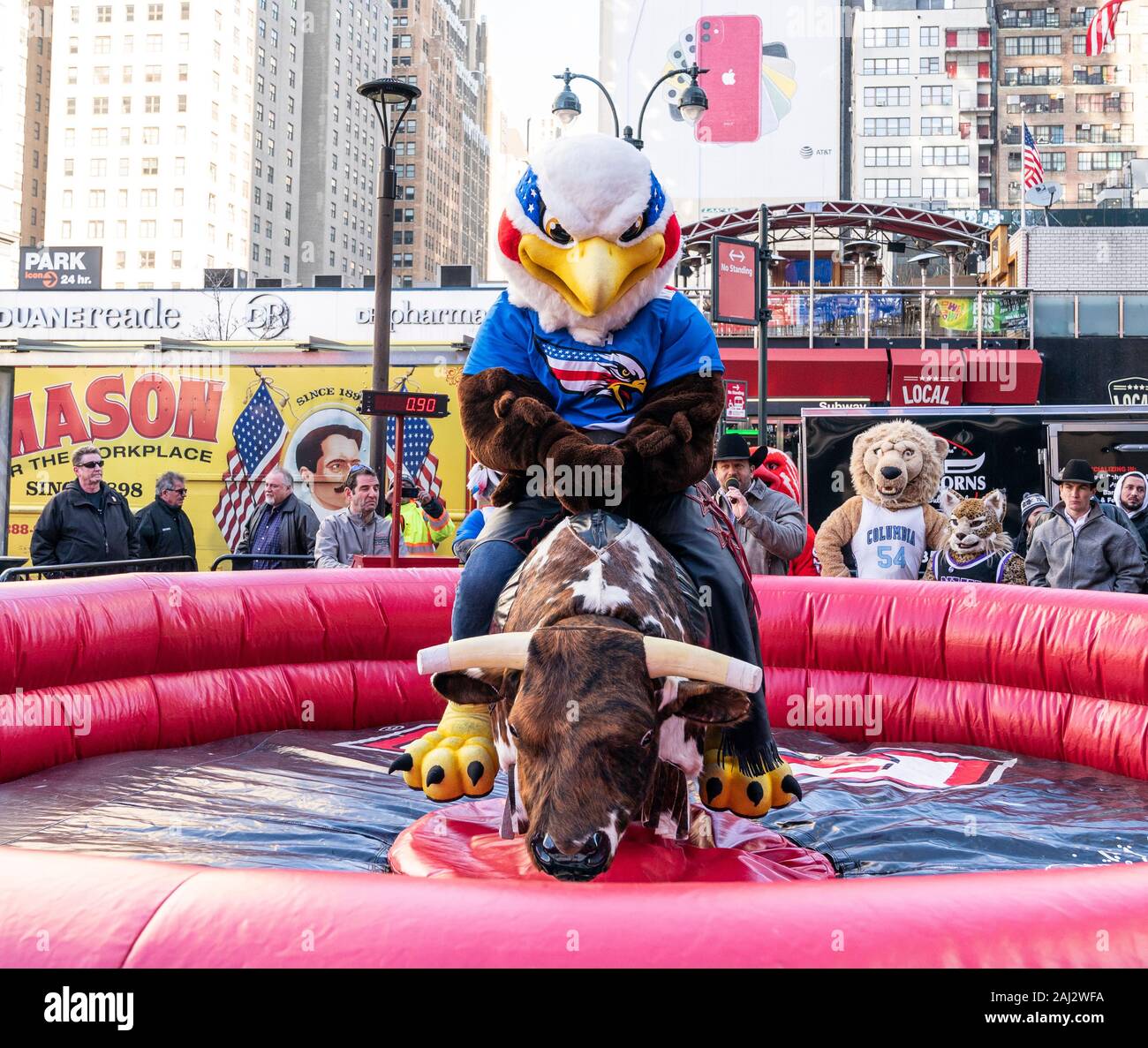 New York, NY - January 2, 2020: PBR team Eagles mascot rides mechanical bull during Professional Bull Riders launch of season 2020 outside of Madison Square Garden Stock Photo