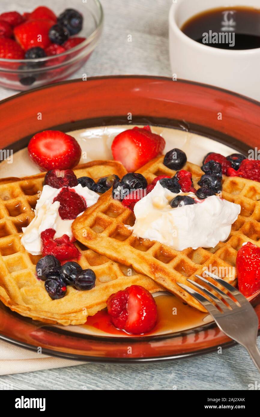Waffles with blueberries,strawberries, and whipped cream Stock Photo ...