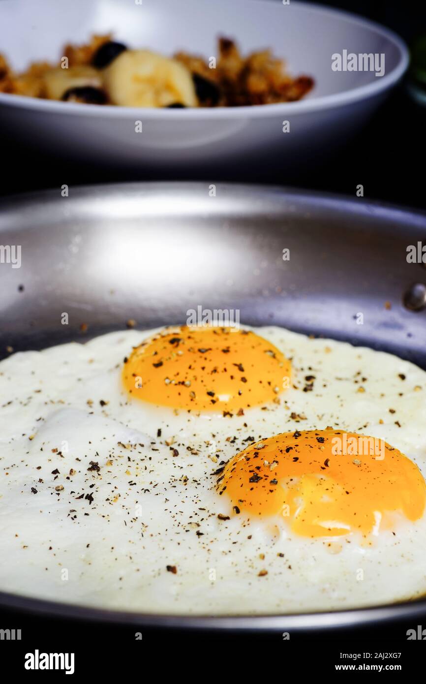 BReakfast of two fried eggs, sunny side up Stock Photo - Alamy
