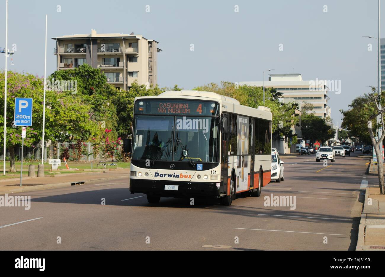 Street scene in central Darwin, Northern Territory, Australia.  Cars and a public transport bus travelling along Smith St. Stock Photo