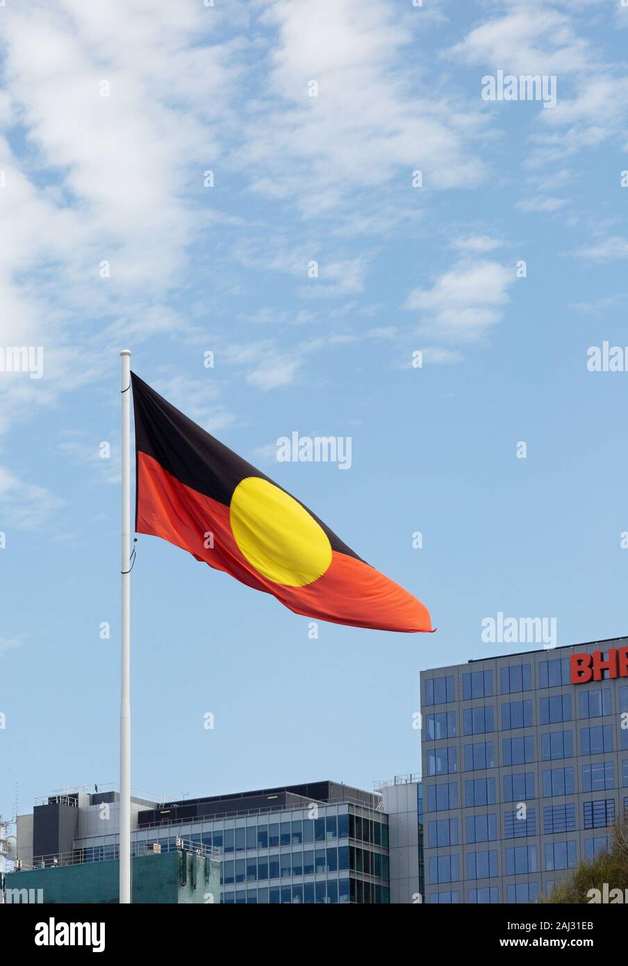 The Australian Aboriginal flag flying in Victoria Square, Adelaide, South Australia Stock Photo