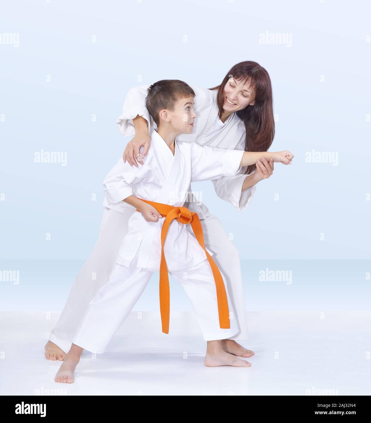 Mother and son are training karate kick Stock Photo Alamy