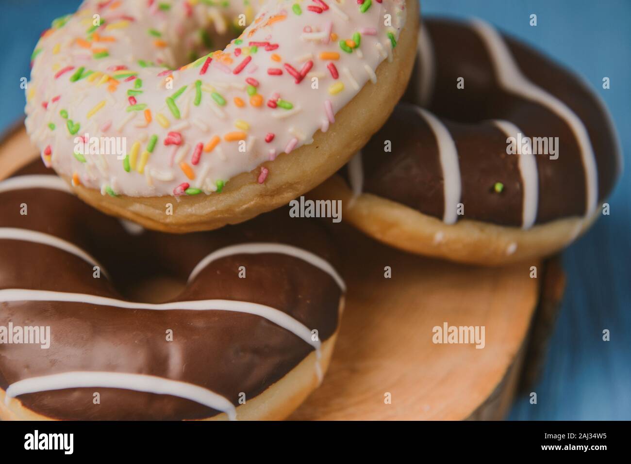 donuts lying on the table. blue background. Stock Photo