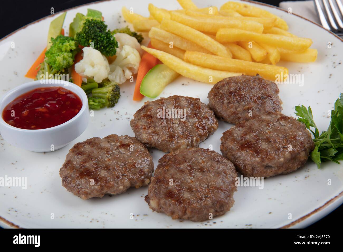 Turkish Food Kofte or Kofta. Delicious Turkish Kofte and Fries (meatballs). Stock Photo