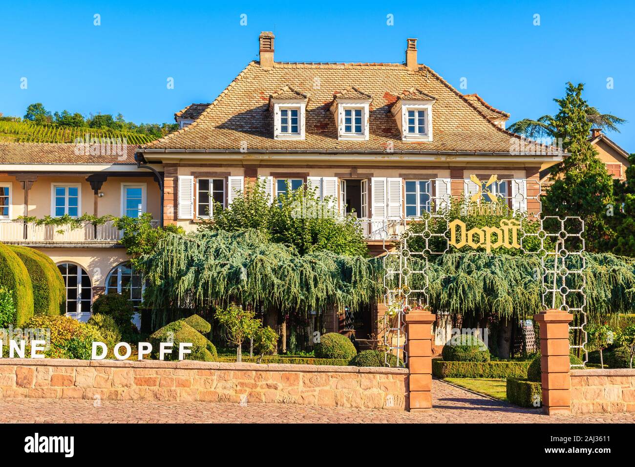 RIQUEWIHR, FRANCE - SEP 19, 2019: Beautiful historic house in old part of Riquewihr village which is located on famous wine route in Alsace region of Stock Photo