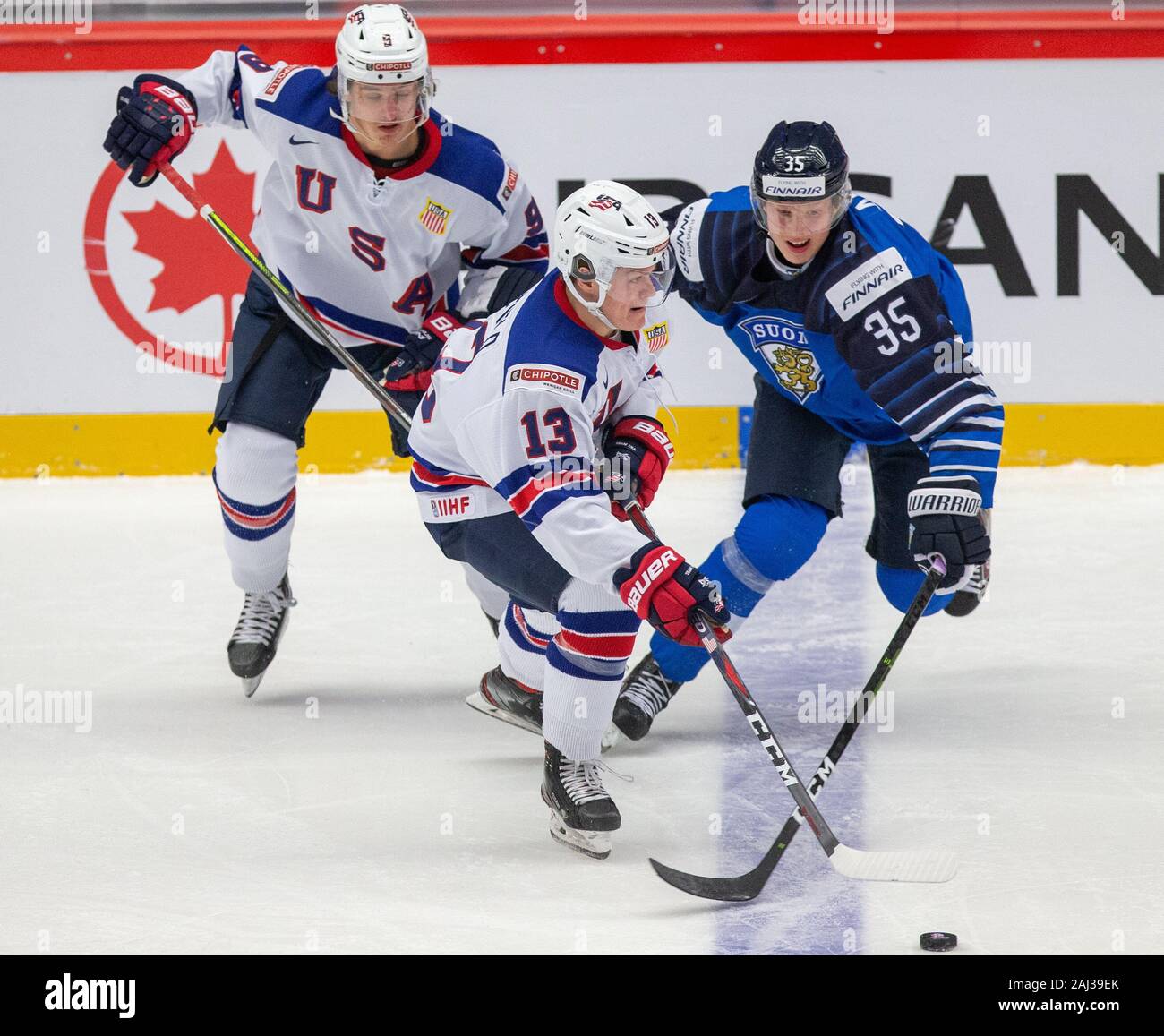L R Trevor Zegras And Cole Caufield Both Usa And Aku Raty Fin In Action During The 2020 Iihf World Junior Ice Hockey Championships Quarterfinal Match Between Usa And Finland In Trinec Czech