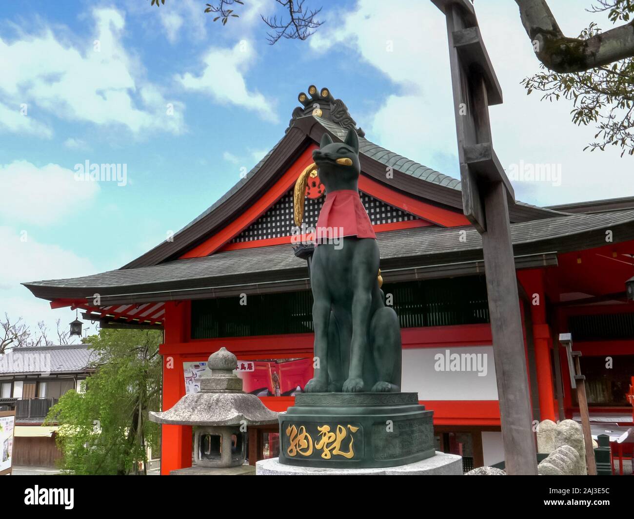 KYOTO, JAPAN - APRIL, 16, 2018: fox statue holding a rice sheaf at ...