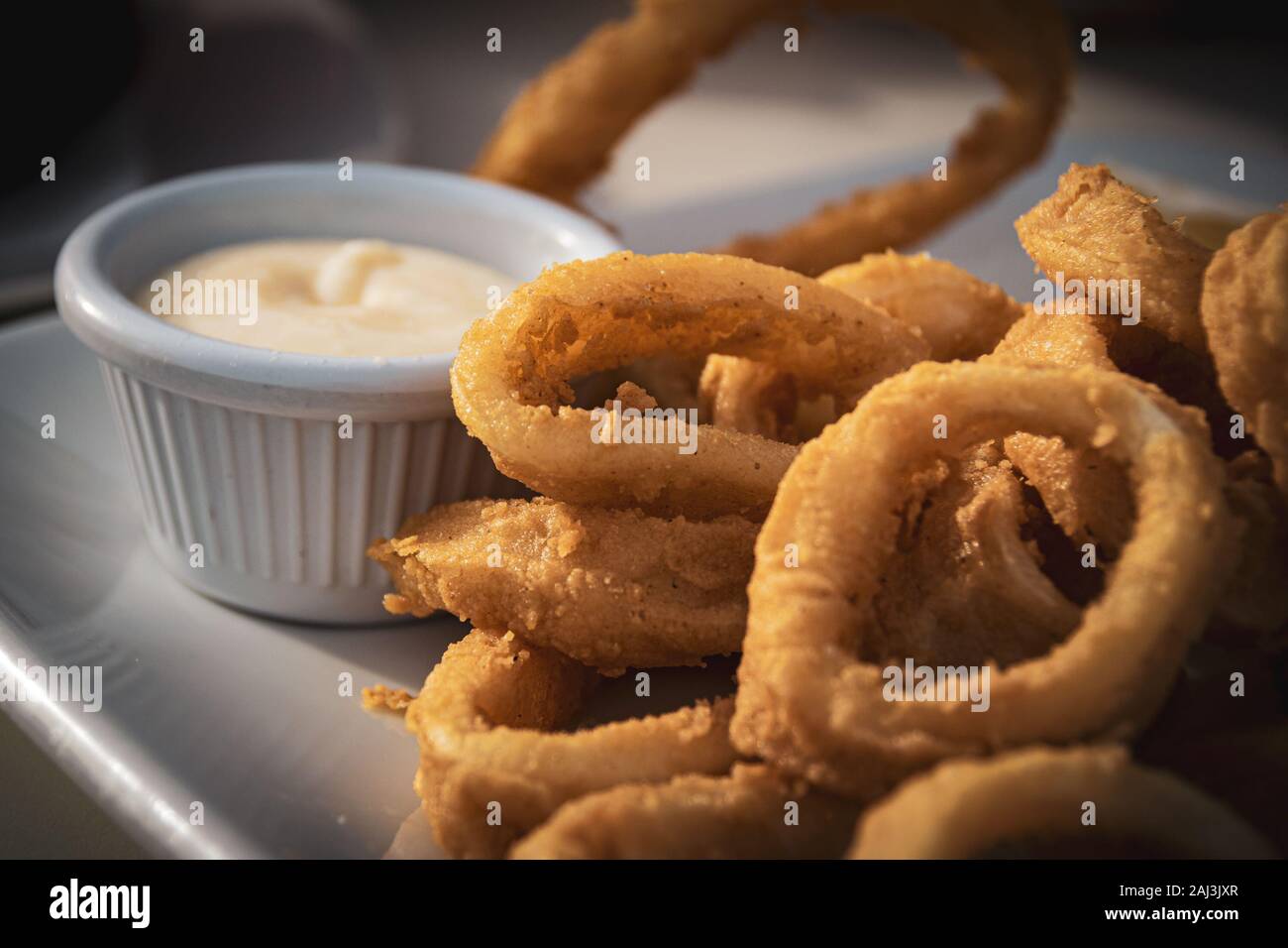 Fried calamares with alioli, typical snack served in the most of