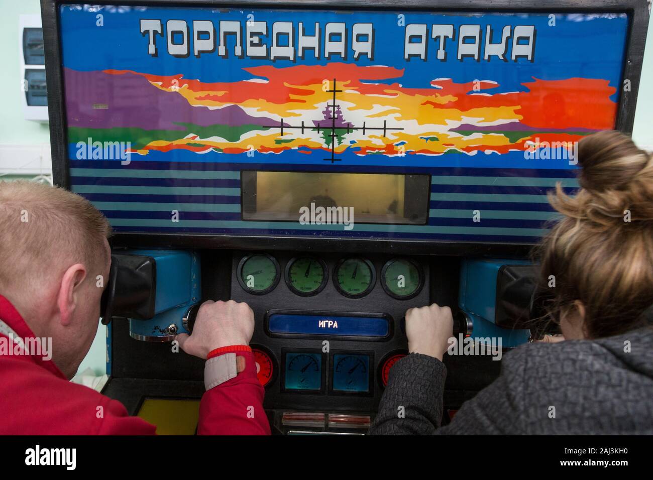People play on a popular Soviet slot machine 'Torpedo attack' (next generation of popular slot machine Battleships or Sea Battle) in the pavilion of VDNKh exhibition centre in Moscow, Russia Stock Photo