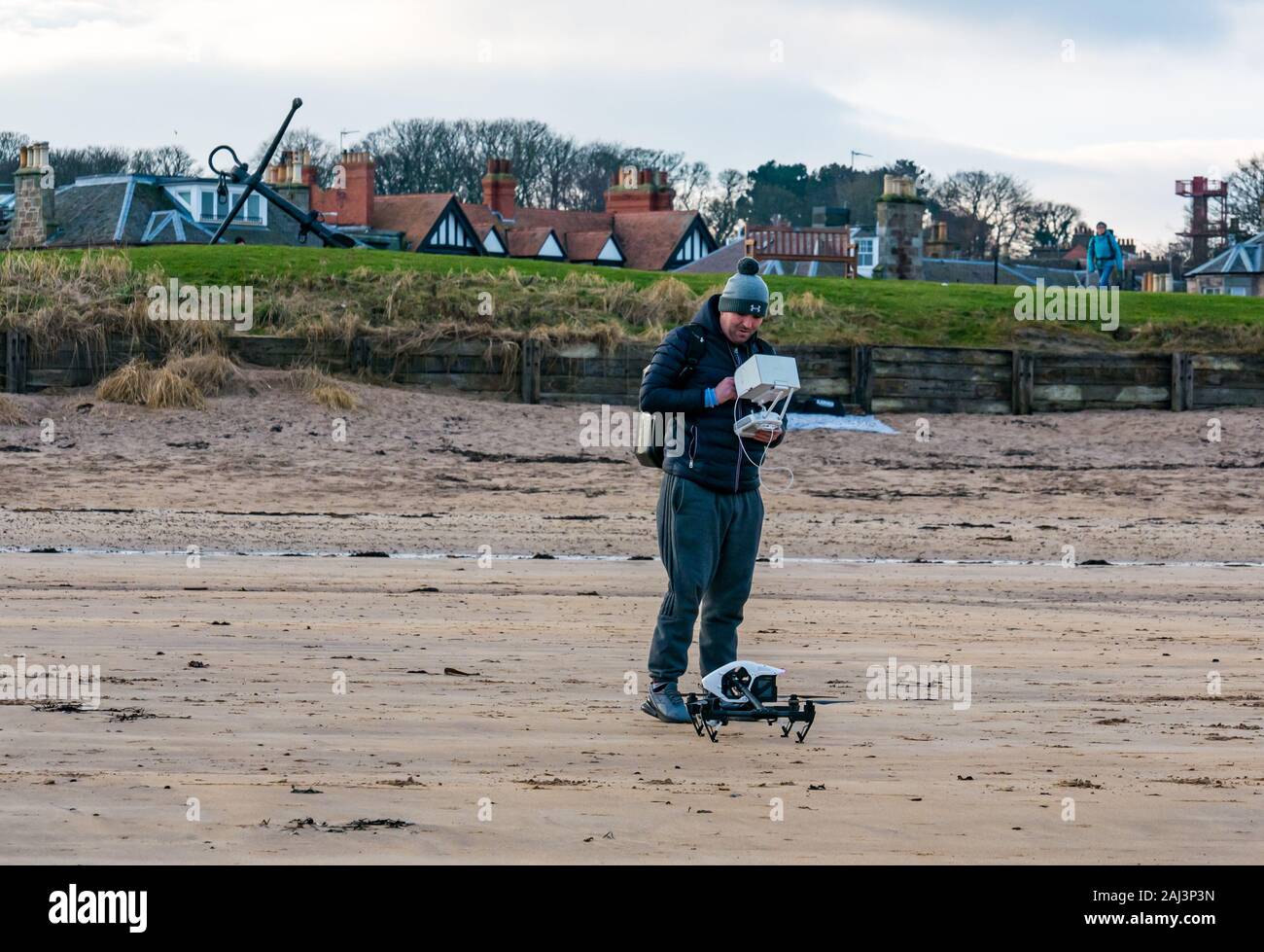 A man flying a drone, West Beach, North Berwick, East Lothian, Scotland, UK Stock Photo