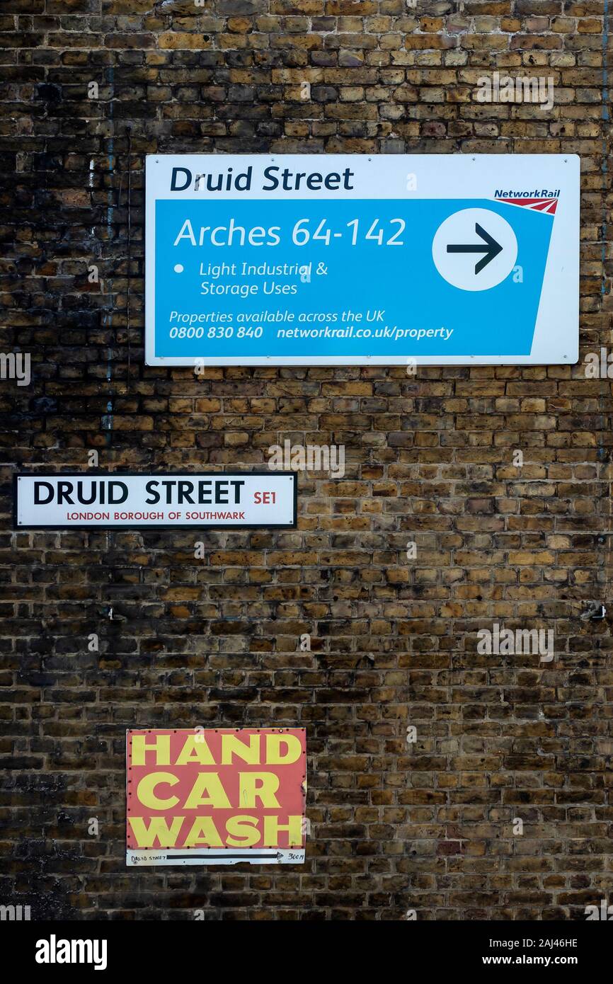 LONDON, UK - SEPTEMBER 29, 2019:  Signs on railway arches by Druid Street Stock Photo