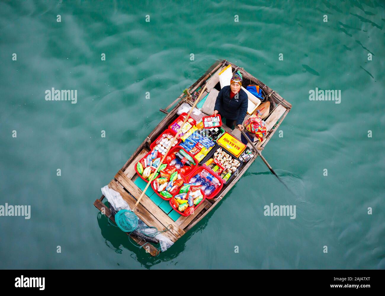 Floating sales people approaching cruise ships selling goods - Ha Long ...