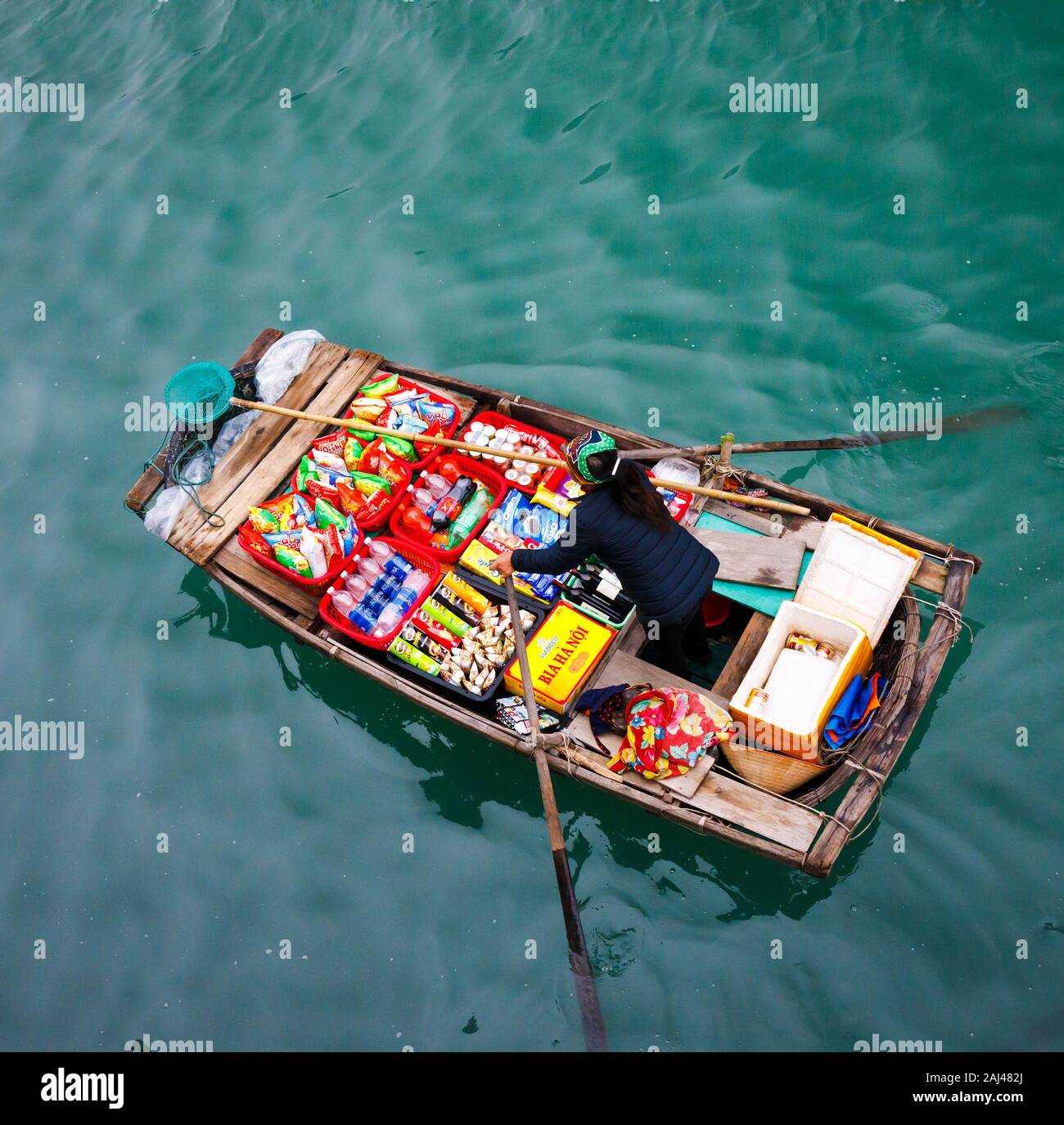 Floating sales people approaching cruise ships selling goods - Ha Long ...