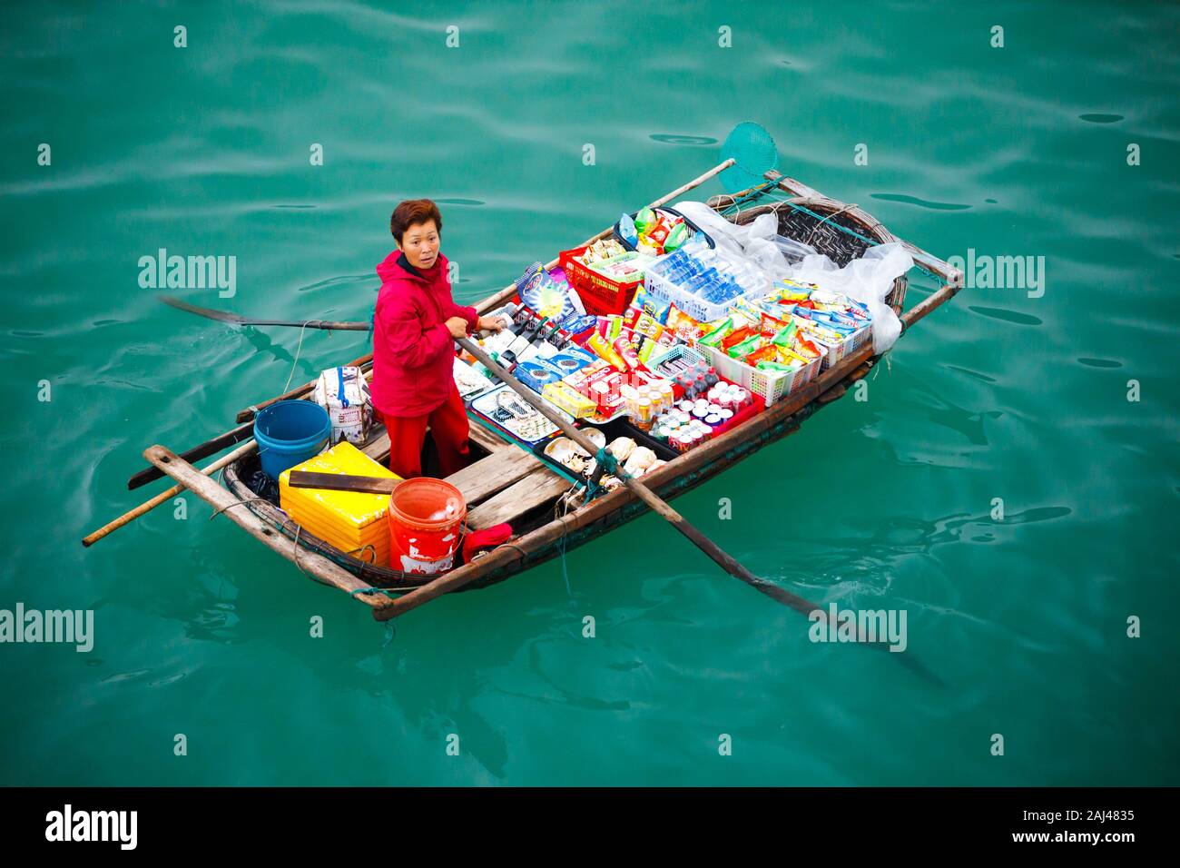 Floating sales people approaching cruise ships selling goods - Ha Long ...
