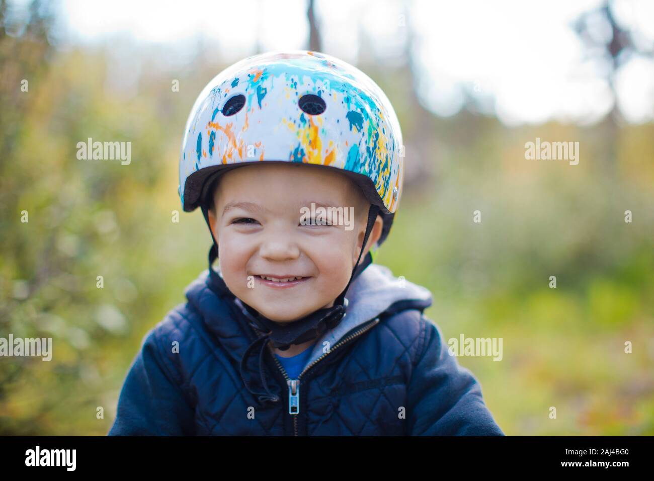 Portrait of young boy with bike helmet on. Stock Photo