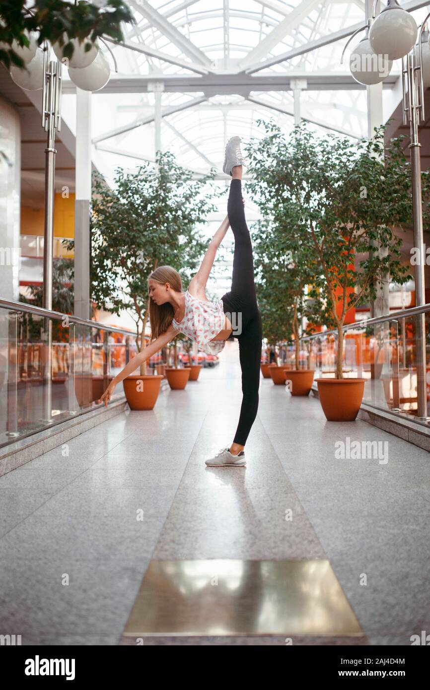 Professional ballerina lifting her leg high Stock Photo