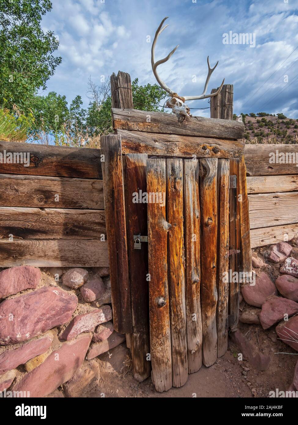Door into dugout, John Jarvie Historic Property, Browns Park, Utah. Stock Photo