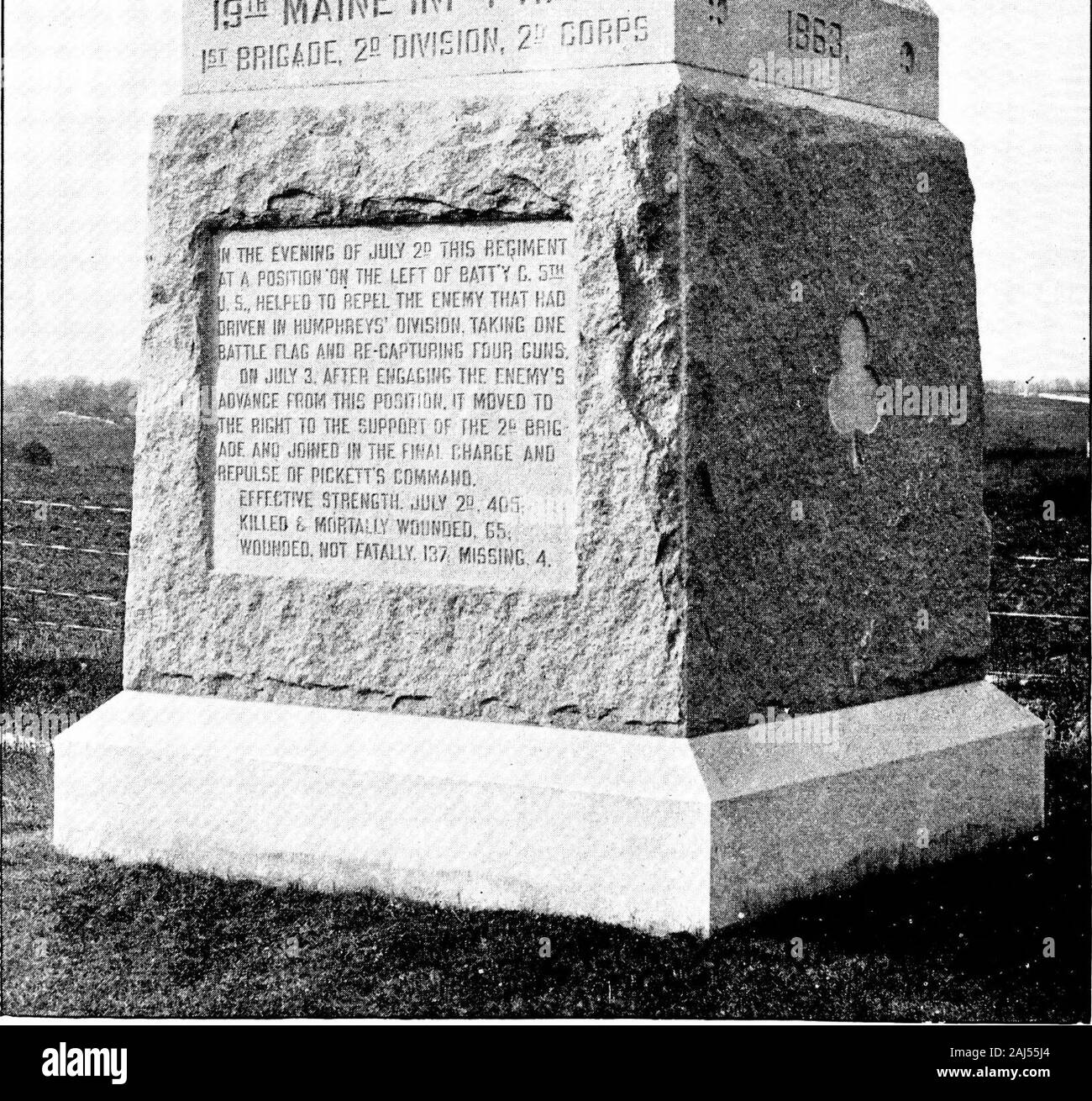 Maine at Gettysburg [electronic resource] . NINETEENTH MAINE REGIMENT. 289 MONUMENT. The monument, of cut Hallowell granite, is a massive cube, surmountedby a pyramidal top. It stands west of Hancock avenue, to the left of thecopse of trees known as the Bloody Angle, in the position held by the regi-ment while awaiting Picketts charge. Admeasurements: Base, 7 feet by 7 feet by 1 foot 8 inches; die, 6 feetby 6 feet by 5 feet 4 inches; apex, 5 feet 4 inches by 5 feet 4 inches by 5 feet7 inches. Total height, 12 feet 7 inches. Upon the faces of the cube are the date 1863, the trefoil of the Secon Stock Photo