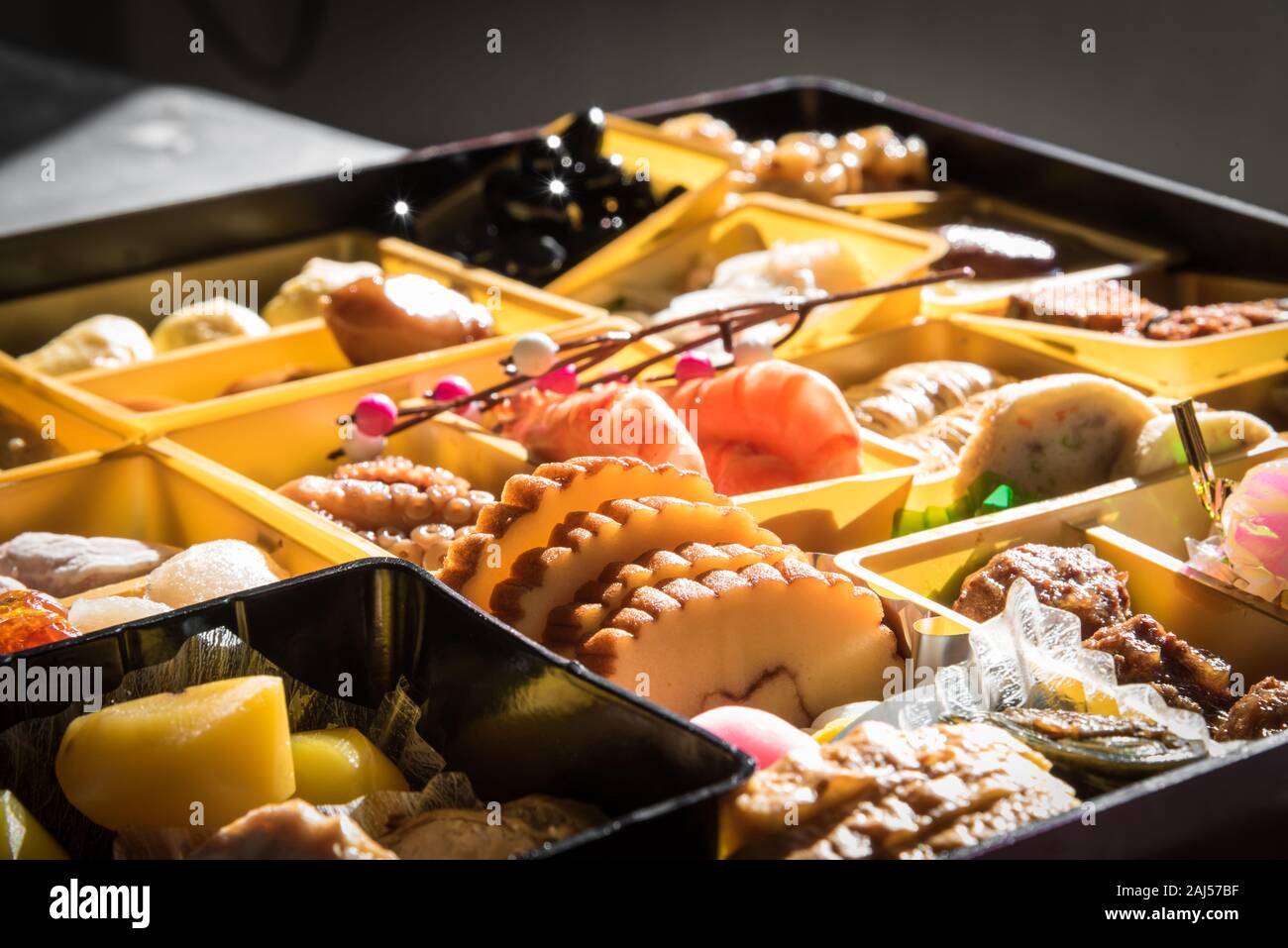 Osechi Ryori are traditional dishes enjoyed by Japanese people on New Year's day. Osechi are easily recognizable by their special boxes called jubako. Stock Photo