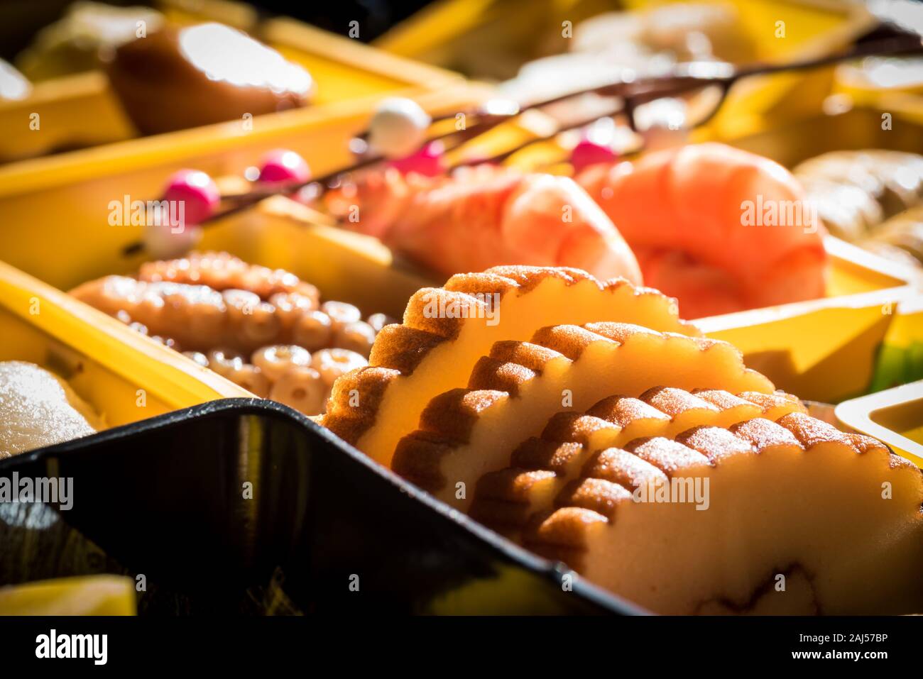 Osechi Ryori are traditional dishes enjoyed by Japanese people on New Year's day. Osechi are easily recognizable by their special boxes called jubako. Stock Photo