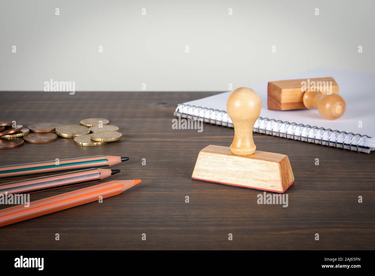 Stamps, stationery, note pad and euro cents on wooden table. Copy space. Background for advertising and information Stock Photo