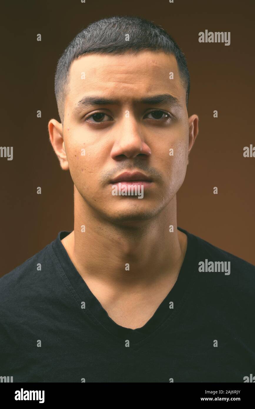 Asian man wearing black hi-res stock photography and images - Alamy