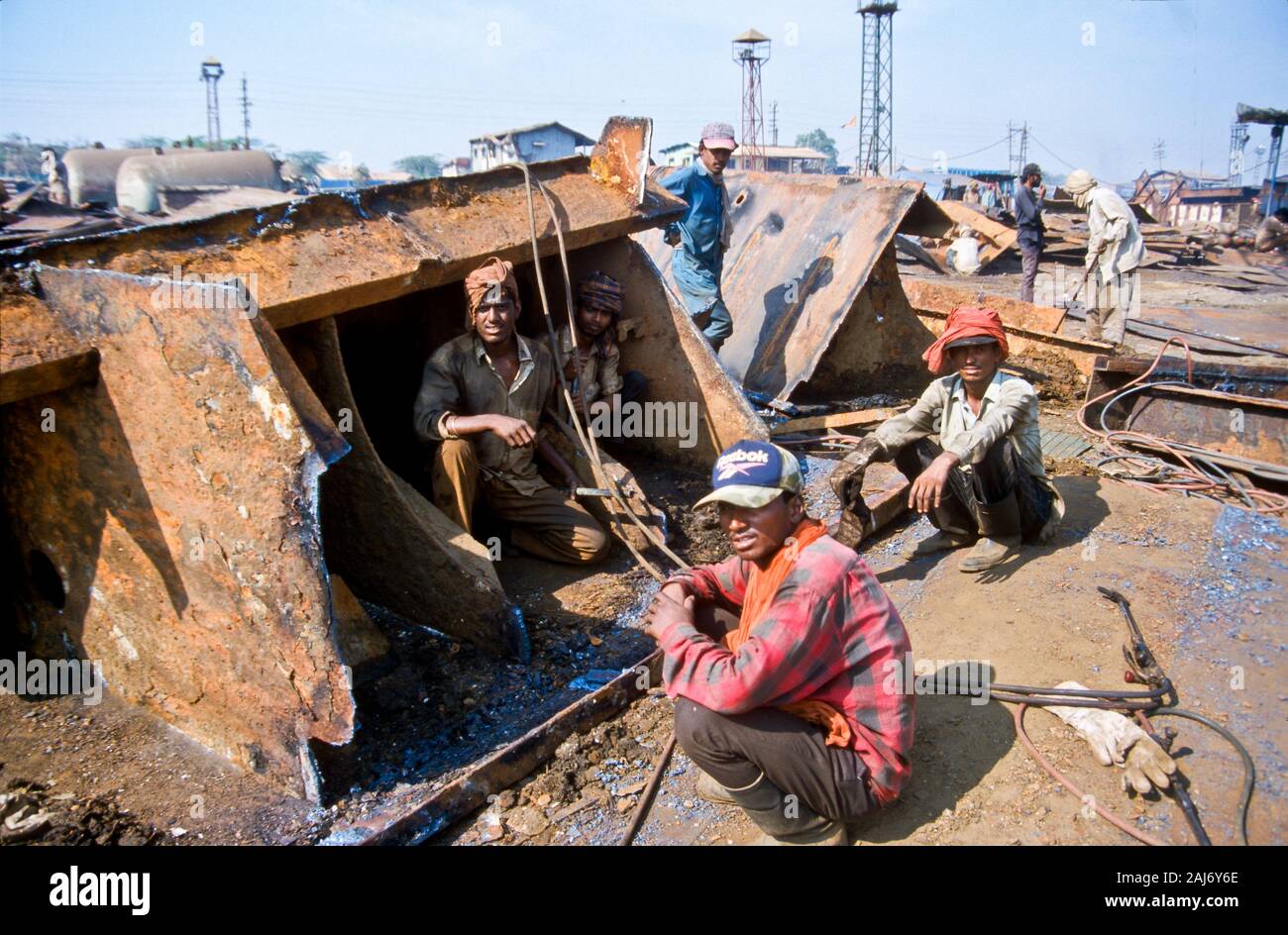 Alang is the largest shipbreaking place on earth. Labour from the poor areas of India work under horrible conditions. Stock Photo