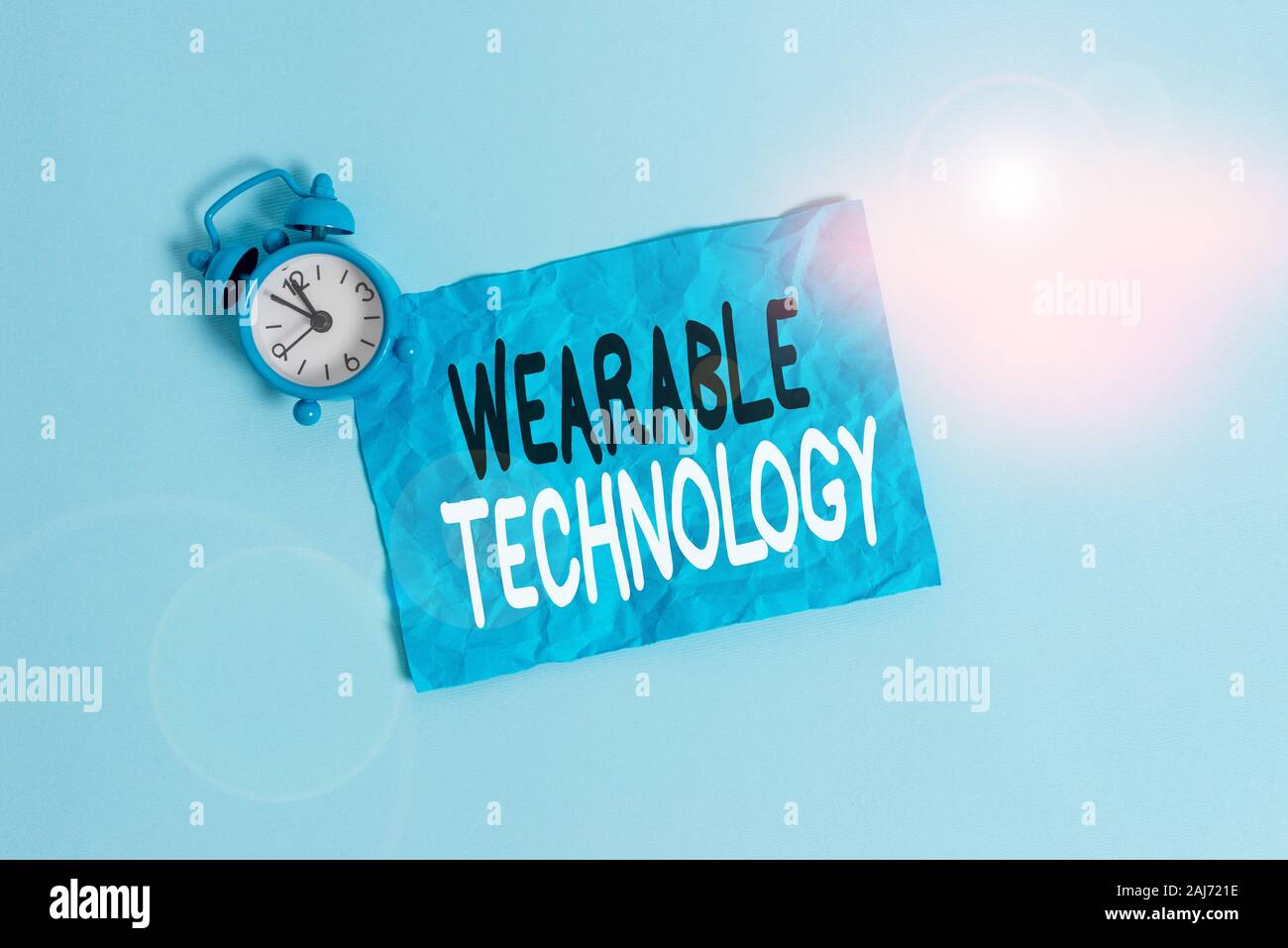 Conceptual hand writing showing Wearable Technology. Concept meaning electronic that can be worn as accessories Metal vintage alarm clock crus Stock Photo - Alamy