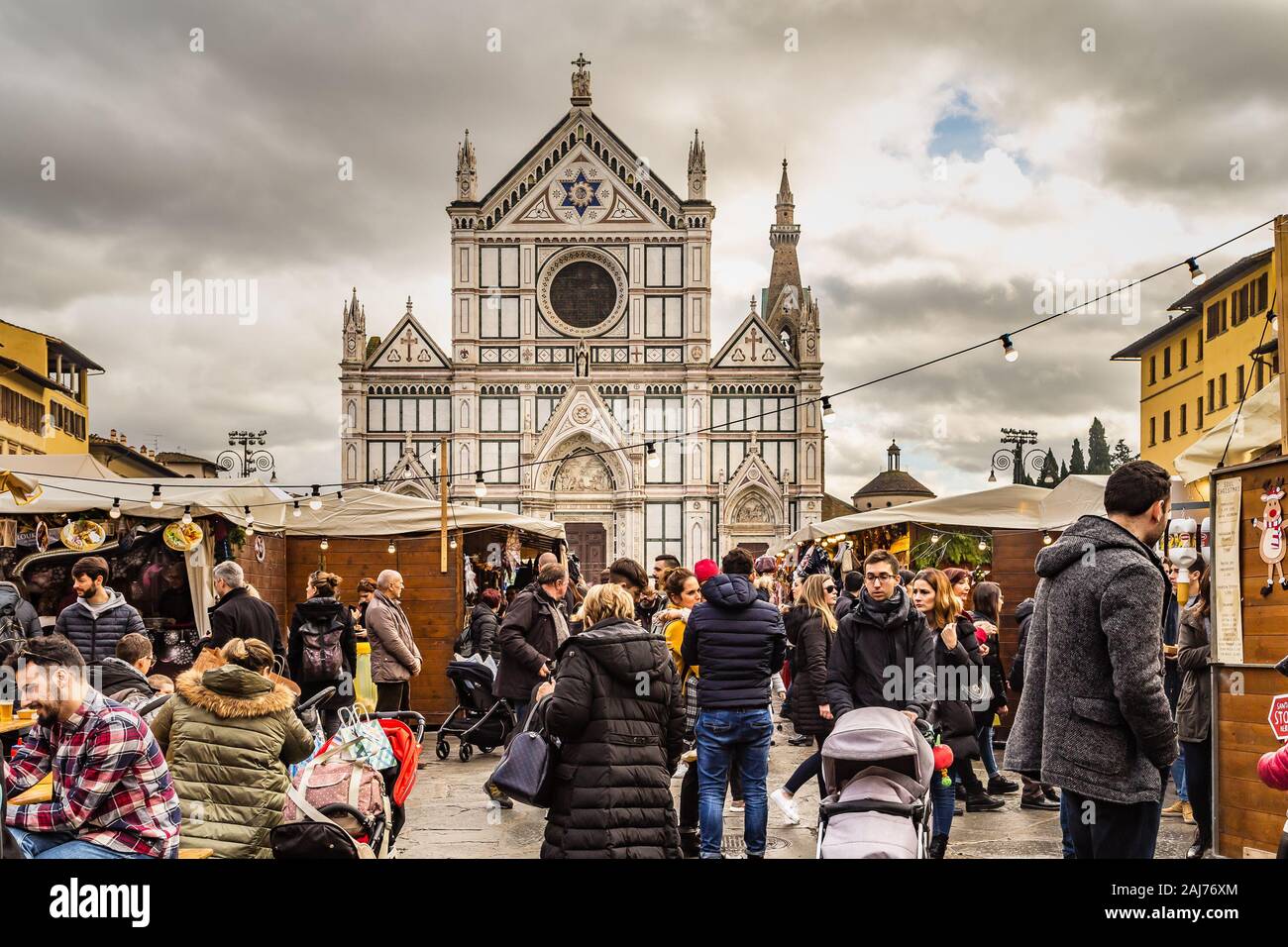 FLORENCE, ITALY - DECEMBER 15, 2019: tourists are visiting the German Christmas market in Florence in Italy Stock Photo