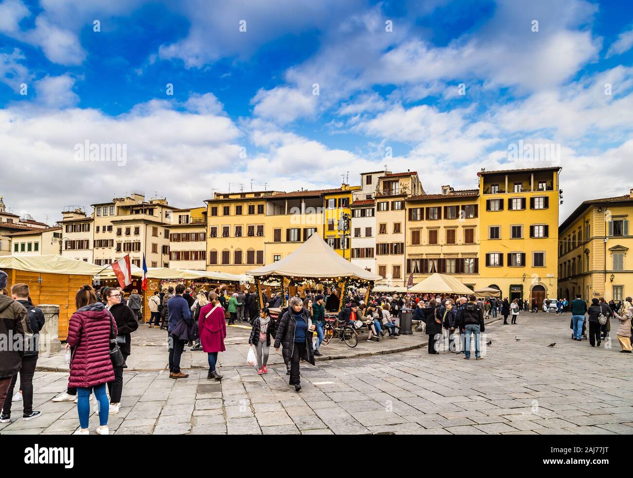 FLORENCE, ITALY - DECEMBER 15, 2019: tourists are visiting German Christmas market in Florence in Italy Stock Photo