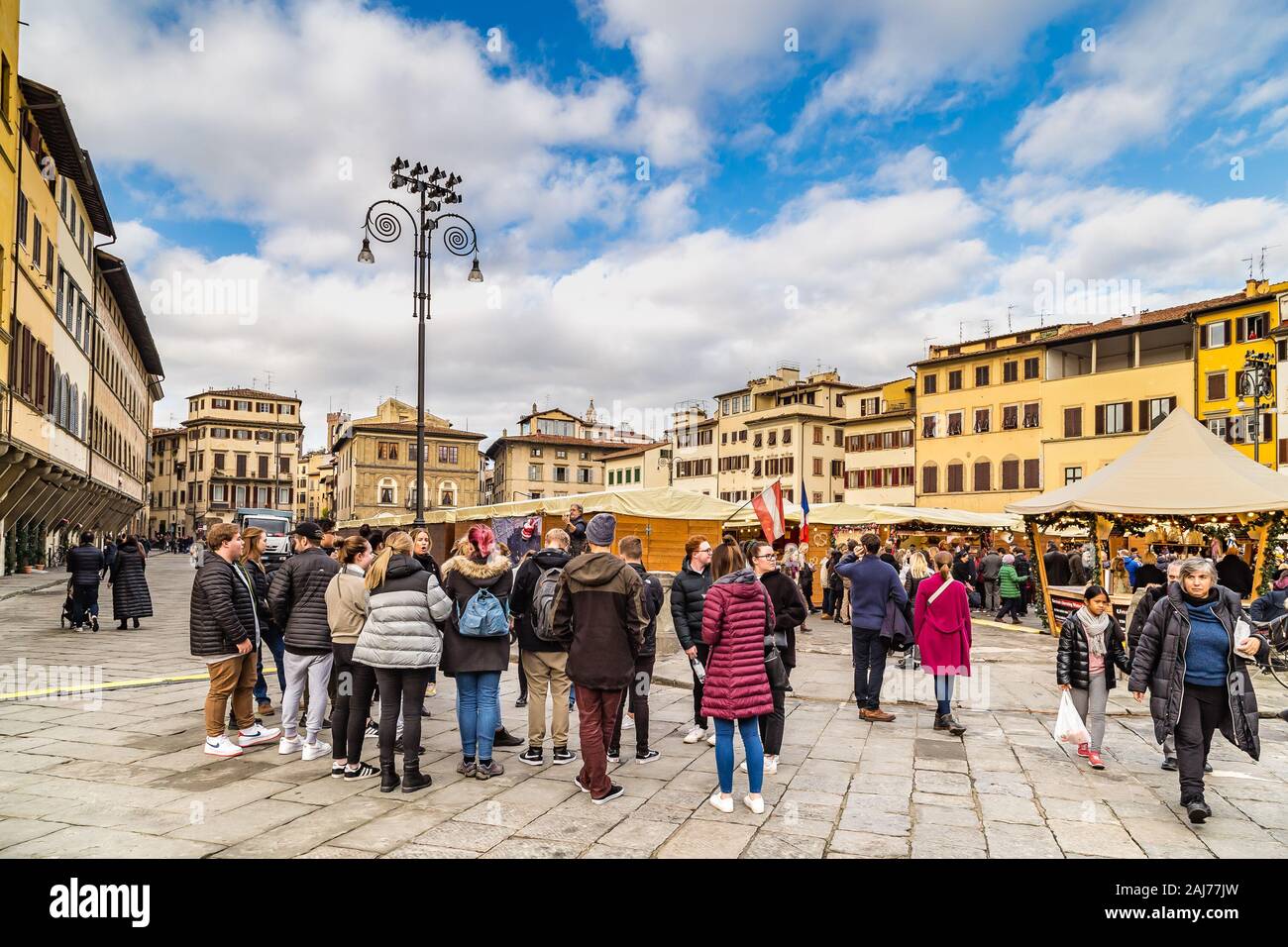 FLORENCE, ITALY - DECEMBER 15, 2019: tourists are visiting German Christmas market in Florence in Italy Stock Photo