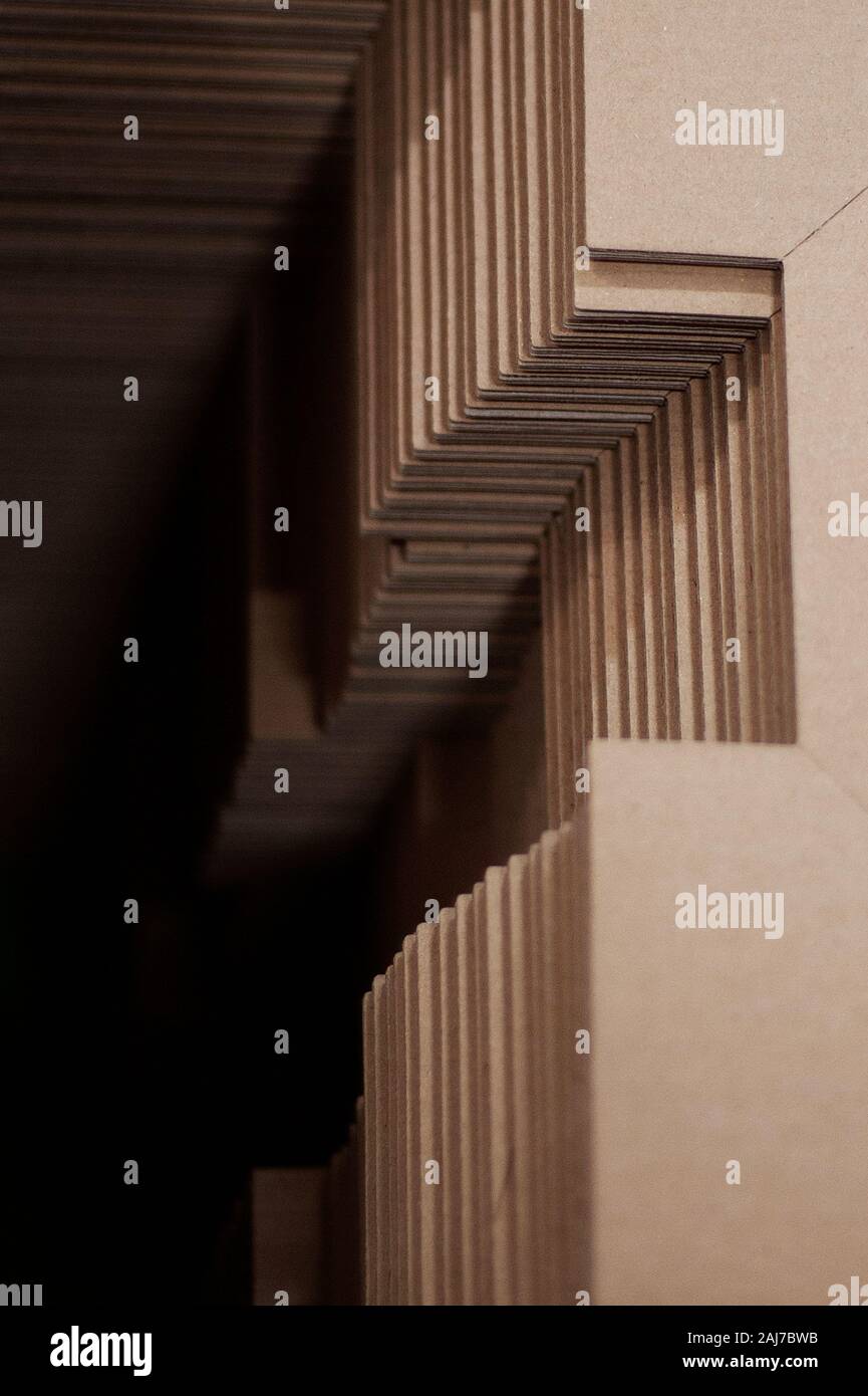Cardboard engineering / cut outs in stack of unassembled cardboard