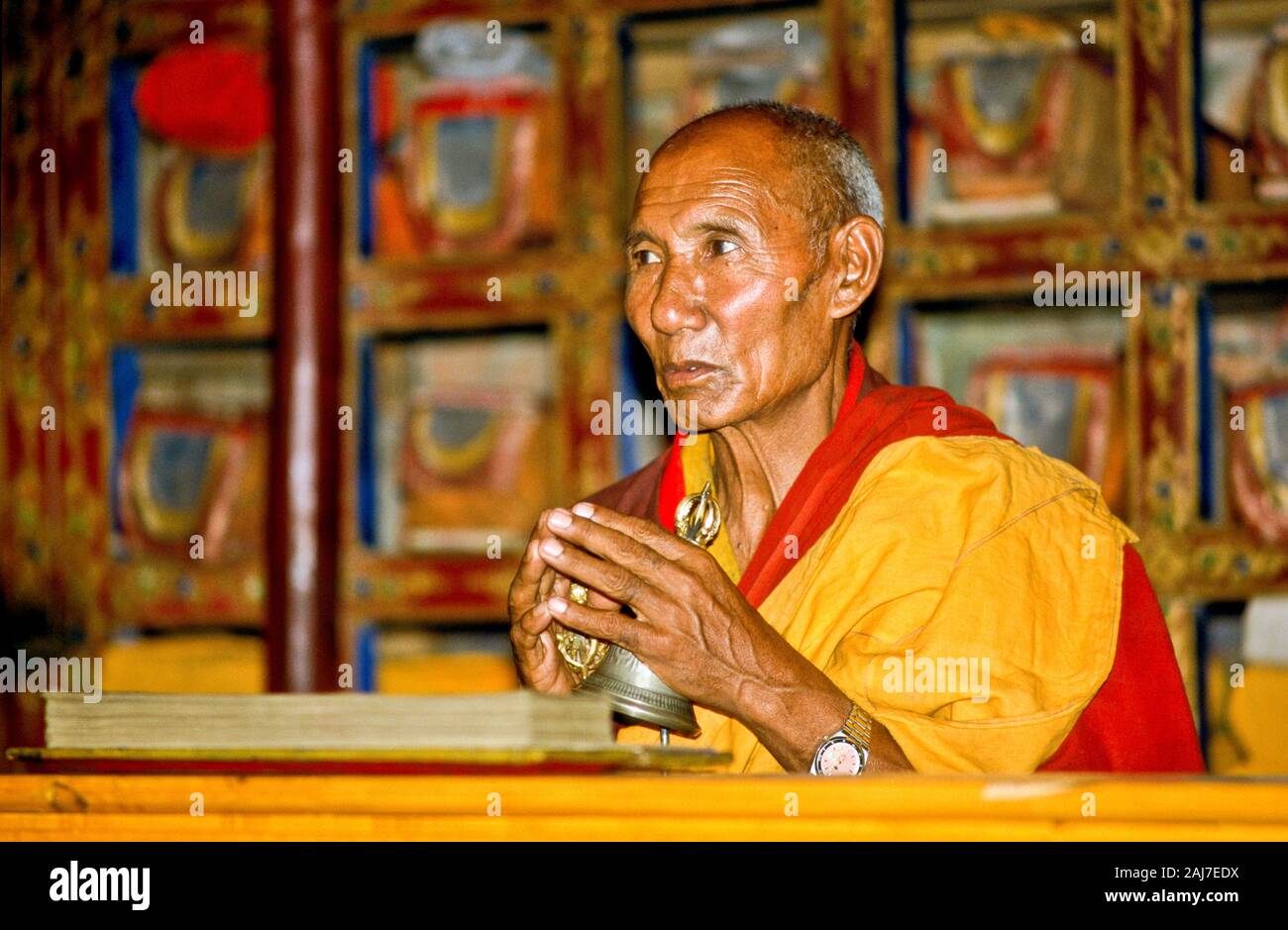 buddhist monk praying in front of the libary Stock Photo