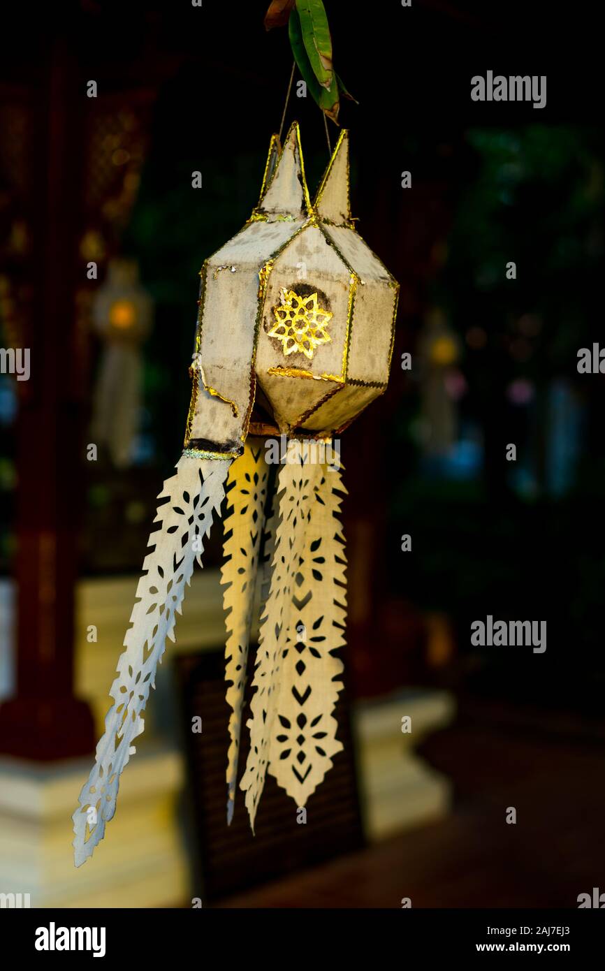 Yi peng or Lanna chrome, northern style of Thai hanging paper lantern in a temple in northern Thailand. Photograph: Iris de Reus Stock Photo