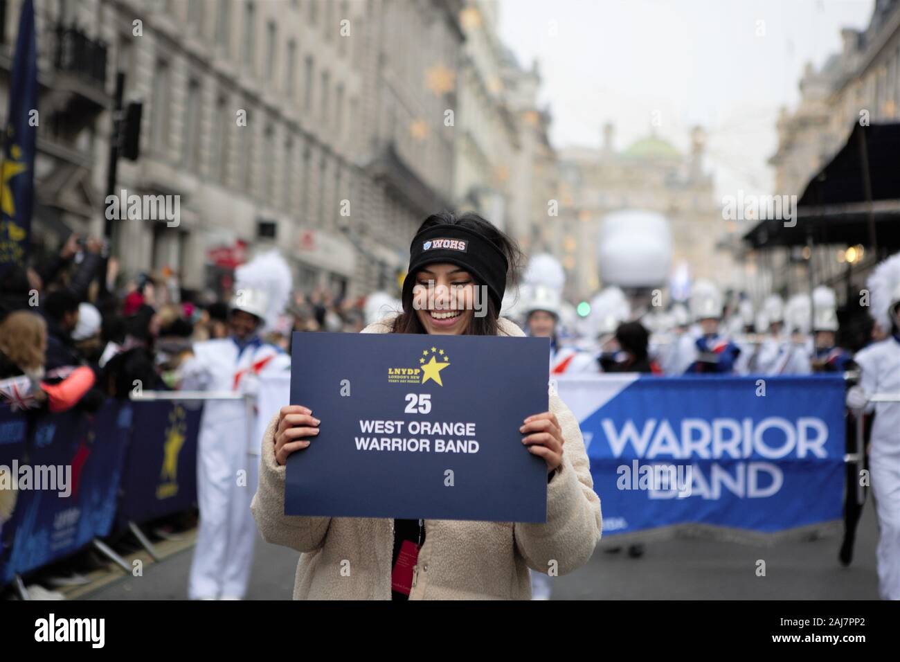 Attendee holding a placard at London New Year's Day Parade 2020 Stock Photo
