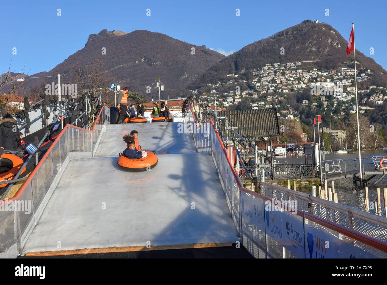 Lugano, Switzerland - 10 July 2016 - children who practice ice tubing at Lugano on Switzerland Stock Photo